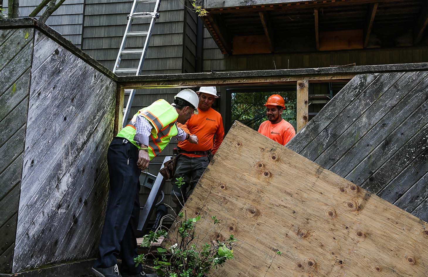 Workers working on water damage of Summit Ridge development